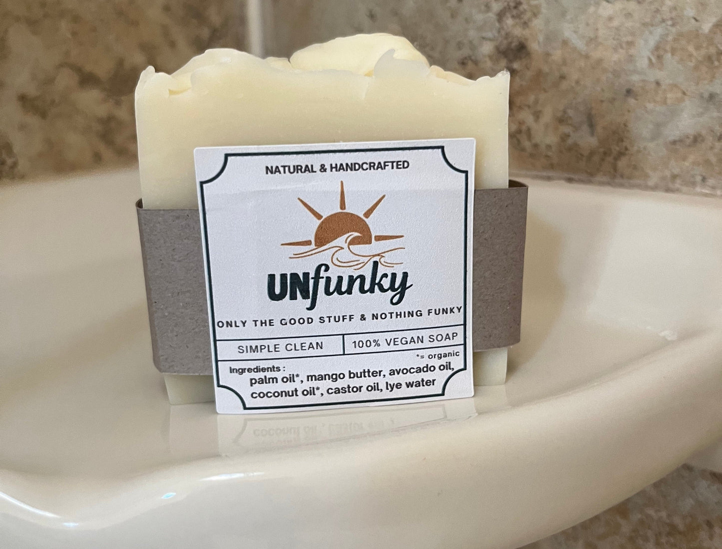 Unfunky vegan soap bar with a label on a stone surface
